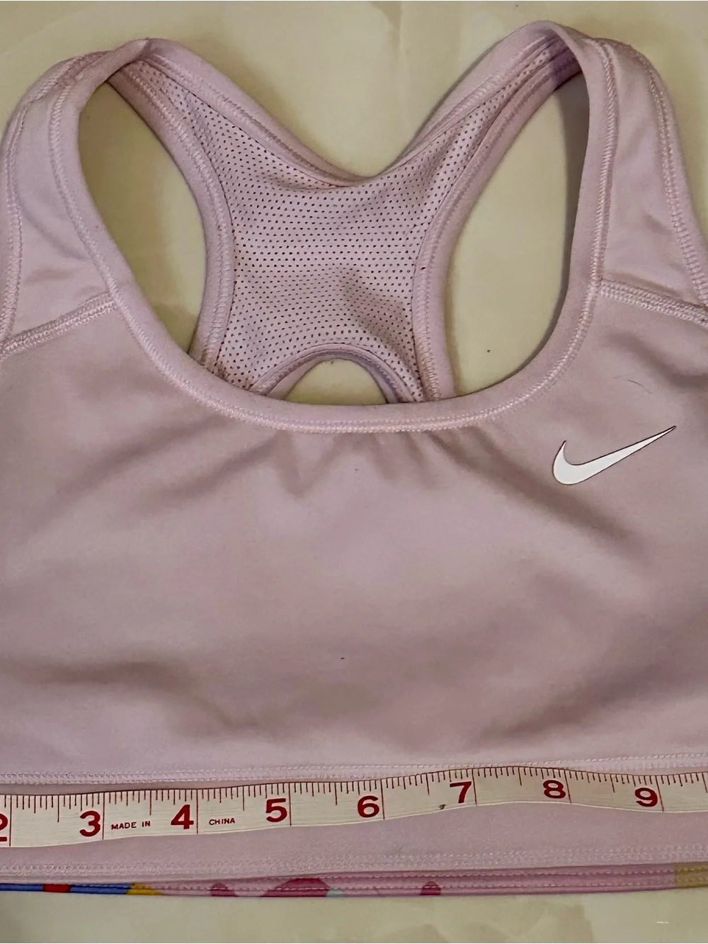 Nike Light Pink Racerback Sports Bra with White Swoosh
